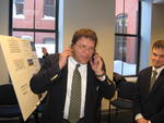 Stef Keenan handles incoming calls, Can you hear me now? Auction Photo