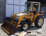 Cub Cadet 4wd tractor w/ 417 loader bucket attachment Auction Photo