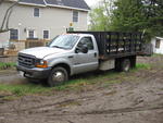 2001 Ford F350 Diesel w/ 12ft. rack body Auction Photo