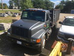 1997 INTERNATIONAL 4700 4X2 SINGLE AXLE CHIP TRUCK Auction Photo