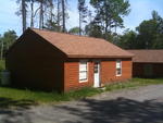 Repair Facility  Restaurant (4) - Rental Cabins  (2) Bldg. Lots - Rolling Stock & Shop Equip. Auction Photo