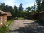 Repair Facility  Restaurant (4) - Rental Cabins  (2) Bldg. Lots - Rolling Stock & Shop Equip. Auction Photo