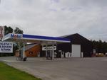 Repair Facility  Restaurant (4) - Rental Cabins  (2) Bldg. Lots - Rolling Stock & Shop Equip. Auction Photo