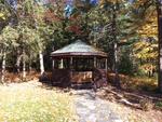 Custom Log Home - 72.5+/- Acres - Pond, 48 East Buskport Rd., Orrington, Maine Auction Photo