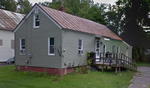 2BR Cape Style Home - .13+/- Acres Auction Photo