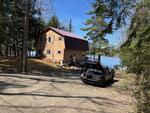 4BR Gambrel Style Waterfront Home - .34+/- Acres  Auction Photo