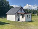 9-Unit Lodging Complex, 7,072+/-SF - 1.89+/- Acres Akers Pond Inn and Cabins Auction Photo