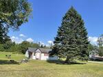 9-Unit Lodging Complex, 7,072+/-SF - 1.89+/- Acres Akers Pond Inn and Cabins Auction Photo