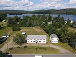 9-Unit Lodging Complex, 7,072+/-SF - 1.89+/- Acres Akers Pond Inn and Cabins Auction Photo